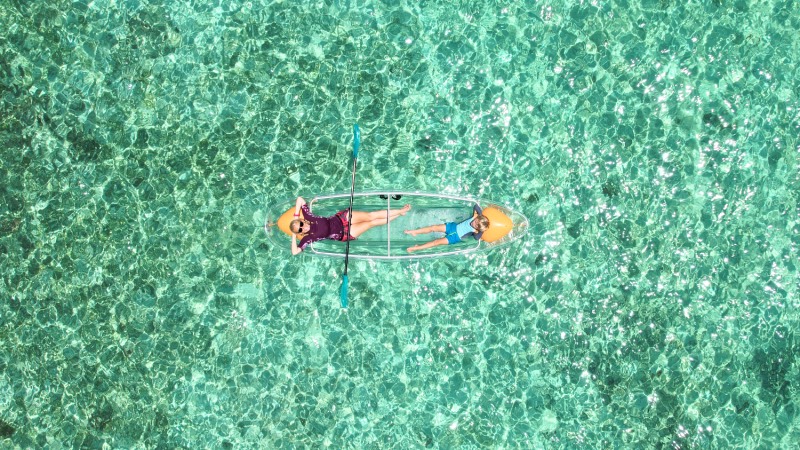 transparent kayak clear water Mabul Sabah