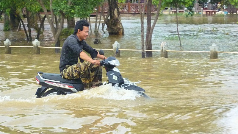 Motorbike in floods Siem Reap